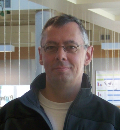 Murray Rice, Ph.D. posing in atrium
